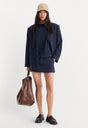 THE TROUSER MINI SKIRT | NAVY PINSTRIPE-1 | GOOD AMERICAN | MODEL