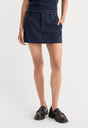 THE TROUSER MINI SKIRT | NAVY PINSTRIPE-2 | GOOD AMERICAN | MODEL